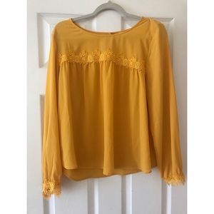 Yellow blouse.